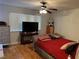 Spacious bedroom with hardwood floors, a large bed, and ceiling fan at 2679 Jacyra Ave, Las Vegas, NV 89121