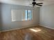 Bedroom featuring a ceiling fan, hardwood floors, and a window at 2679 Jacyra Ave, Las Vegas, NV 89121