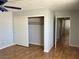 A bedroom featuring a closet, ceiling fan, and hallway access at 2679 Jacyra Ave, Las Vegas, NV 89121