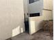 Exterior view of yard and condo building entry with gate and mature landscaping at 2679 Jacyra Ave, Las Vegas, NV 89121