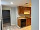 Kitchen featuring wood cabinets, a stainless steel sink, and a view to the garage at 2679 Jacyra Ave, Las Vegas, NV 89121