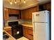 Kitchen with wood cabinets, stainless steel appliances, and tile flooring at 2679 Jacyra Ave, Las Vegas, NV 89121