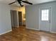 A comfortable living room with a ceiling fan, a door, and access to the bathroom at 2679 Jacyra Ave, Las Vegas, NV 89121