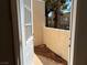 View from an open door to a patio, with desert landscaping and a view of surrounding buildings at 2679 Jacyra Ave, Las Vegas, NV 89121
