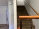 Carpeted staircase with wood handrail at 2679 Jacyra Ave, Las Vegas, NV 89121