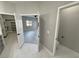 View of the primary bathroom with a walk-in closet, water closet and bedroom at 2700 W Carnation Way, Pahrump, NV 89048