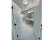 View of ensuite bathroom with marble floors, gray vanity, and large mirrors, exuding luxury at 2700 W Carnation Way, Pahrump, NV 89048