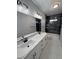 Stylish bathroom featuring double sinks, white countertops, and modern shower at 2700 W Carnation Way, Pahrump, NV 89048