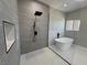 Stylish bathroom with a soaking tub and glass shower; the perfect place to unwind and relax at 2700 W Carnation Way, Pahrump, NV 89048