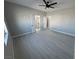 Bedroom features vinyl floors, ceiling fan and doors leading to a closet at 2700 W Carnation Way, Pahrump, NV 89048