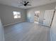 Bedroom featuring vinyl floors, ceiling fan and an ensuite bathroom at 2700 W Carnation Way, Pahrump, NV 89048