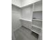 Walk-in closet features ample shelf space with laminate flooring at 2700 W Carnation Way, Pahrump, NV 89048