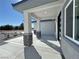 Spacious covered front porch with stone pillars providing shade and style at 2700 W Carnation Way, Pahrump, NV 89048