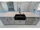 Modern kitchen island with quartz countertops and stainless steel dishwasher at 2700 W Carnation Way, Pahrump, NV 89048