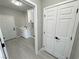 Bright laundry room with ample storage cabinets and modern white appliances at 2700 W Carnation Way, Pahrump, NV 89048