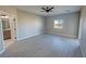 A main bedroom with a ceiling fan and an en-suite bathroom at 2700 W Carnation Way, Pahrump, NV 89048