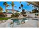 Enjoy the inviting pool and waterfall feature in this private backyard at 2721 Tahiti Isle Ave, North Las Vegas, NV 89031