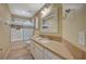 Bathroom with double vanity, bathtub, and tile floor at 2721 Tahiti Isle Ave, North Las Vegas, NV 89031