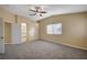 Large bedroom with ceiling fan and access to bathroom at 2721 Tahiti Isle Ave, North Las Vegas, NV 89031