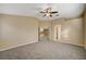 Spacious bedroom with ceiling fan and neutral carpeting at 2721 Tahiti Isle Ave, North Las Vegas, NV 89031