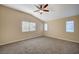 Spacious bedroom with multiple windows and ceiling fan at 2721 Tahiti Isle Ave, North Las Vegas, NV 89031