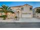 Two-story house with palm trees and a driveway at 2721 Tahiti Isle Ave, North Las Vegas, NV 89031