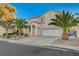 Two-story house with palm trees and a driveway at 2721 Tahiti Isle Ave, North Las Vegas, NV 89031