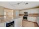 Kitchen with island, wine cooler, and views to Gathering room at 2721 Tahiti Isle Ave, North Las Vegas, NV 89031