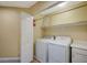 Laundry room with washer, dryer, and storage at 2721 Tahiti Isle Ave, North Las Vegas, NV 89031