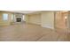 Spacious living room featuring a stone fireplace and wood-look floors at 2721 Tahiti Isle Ave, North Las Vegas, NV 89031