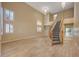 Two-story living room with hardwood floors and grand staircase at 2721 Tahiti Isle Ave, North Las Vegas, NV 89031