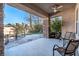 Inviting back patio with stone columns and tiled flooring, perfect for relaxing outdoors at 2794 Evening Rock St, Las Vegas, NV 89135