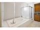 Relaxing bathroom featuring a soaking tub and glass shower at 2794 Evening Rock St, Las Vegas, NV 89135