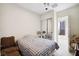 Cozy bedroom with mirrored closet doors and neutral colors at 2794 Evening Rock St, Las Vegas, NV 89135