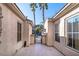 Tranquil courtyard showcasing tiled flooring, view of palm trees and neighborhood at 2794 Evening Rock St, Las Vegas, NV 89135