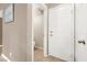 Small half bathroom with toilet and door at 2823 Camelback Ln, Henderson, NV 89074