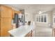 Kitchen with stainless steel appliances, wood cabinets and access to laundry room at 2823 Camelback Ln, Henderson, NV 89074