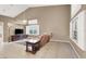 Living room with vaulted ceiling, tile floors and a neutral color scheme at 2823 Camelback Ln, Henderson, NV 89074