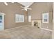 Living room with vaulted ceiling, tile floors, fireplace and neutral color scheme at 2823 Camelback Ln, Henderson, NV 89074