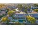 Aerial view of a single-Gathering home with a pool, spa, and mature trees in a suburban neighborhood at 308 Bayswater Ct, Las Vegas, NV 89145