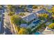 Aerial view of a luxury home with a pool and landscaped grounds in a residential area at 308 Bayswater Ct, Las Vegas, NV 89145