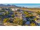 Expansive aerial view of a luxury home with mature trees and mountain views in a desirable neighborhood at 308 Bayswater Ct, Las Vegas, NV 89145