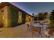 Backyard patio area with comfortable seating, an outdoor dining table and pool access at 308 Bayswater Ct, Las Vegas, NV 89145