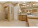 Elegant bathroom featuring a glass shower, double sink vanity, tile floor, and ample storage at 308 Bayswater Ct, Las Vegas, NV 89145