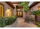 Inviting walkway leading to an elegant front door, surrounded by lush landscaping and stone accents at 308 Bayswater Ct, Las Vegas, NV 89145