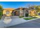 Beautiful home featuring an attached garage, decorative stone accents, and manicured front yard at 308 Bayswater Ct, Las Vegas, NV 89145