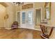 Elegant foyer featuring hardwood floors, a decorative table, and a chandelier at 308 Bayswater Ct, Las Vegas, NV 89145