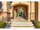 Elegant front entrance with decorative iron gate and stone detailing at 308 Bayswater Ct, Las Vegas, NV 89145