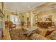 Formal living room with hardwood floors, chandelier, and a view of the front door and dining room at 308 Bayswater Ct, Las Vegas, NV 89145