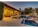 Backyard swimming pool and spa with a covered patio and comfortable seating at 308 Bayswater Ct, Las Vegas, NV 89145